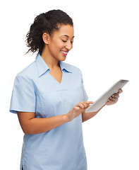 Image showing smiling black doctor or nurse with tablet pc