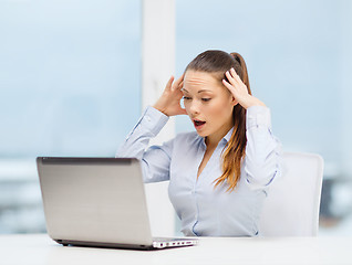 Image showing stressed woman with laptop