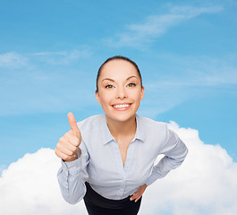 Image showing smiling asian businesswoman showing thumbs up