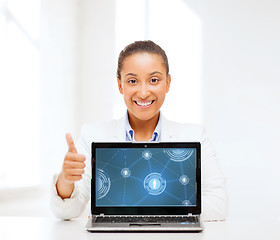 Image showing smiling woman with laptop computer