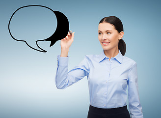 Image showing businesswoman drawing text bubble in the air