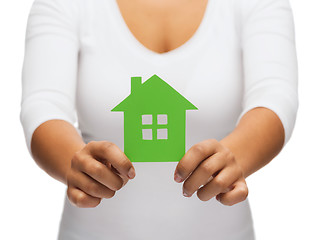 Image showing woman hands holding green house