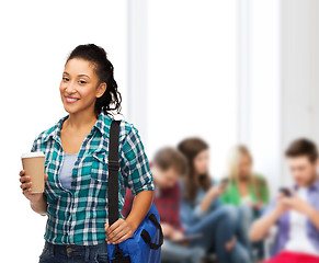 Image showing smiling student with bag and take away coffee cup