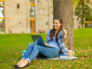 Image showing teenager with laptop and coffee showing thumbs up