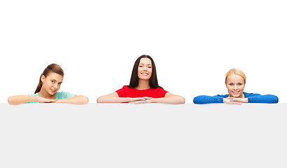 Image showing three women with big blank white board