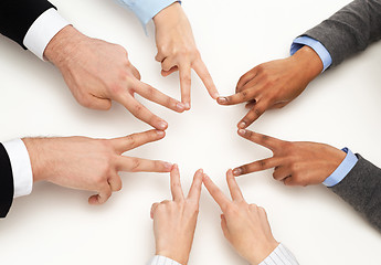 Image showing group of businesspeople showing v-sign