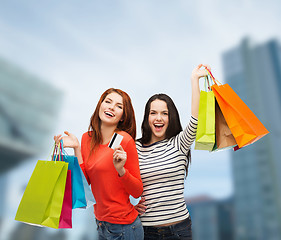 Image showing teenage girls with shopping bags and credit card