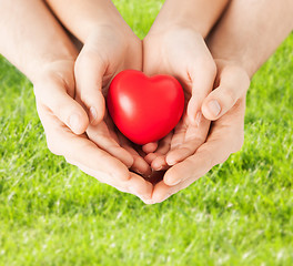 Image showing woman and man hands with heart