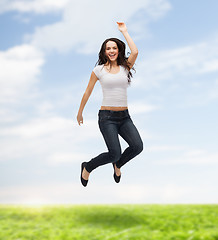 Image showing teenage girl in white blank t-shirt jumping