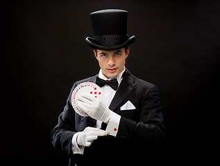 Image showing magician showing trick with playing cards