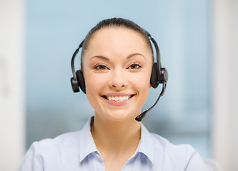 Image showing female helpline operator with headphones