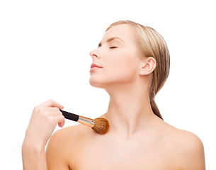 Image showing beautiful woman with makeup brush