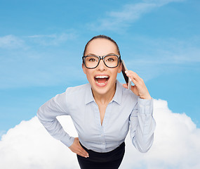 Image showing happy businesswoman in eyeglasses with smartphone