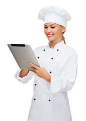 Image showing smiling female chef with tablet pc computer