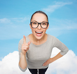 Image showing asian woman in eyeglasses with finger up