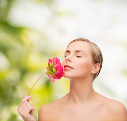 Image showing lovely woman with peonie flower