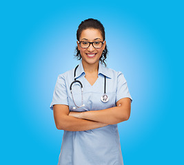 Image showing smiling female african american doctor or nurse