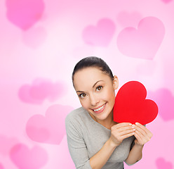 Image showing smiling asian woman with red heart