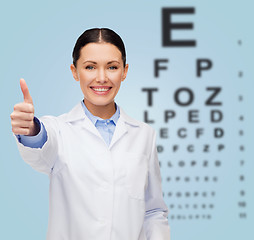 Image showing smiling female doctor showing thumbs up