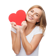 Image showing smiling woman in white t-shirt with heart