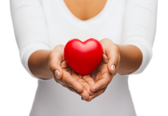Image showing womans cupped hands showing red heart