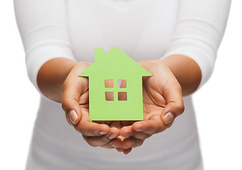 Image showing woman hands holding green house