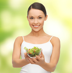 Image showing healthy woman holding bowl with salad