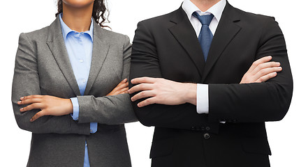 Image showing businesswoman and businessman with crossed arms