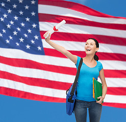 Image showing smiling student with bag and folders