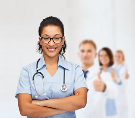 Image showing smiling female african american doctor or nurse