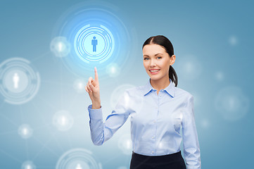 Image showing smiling businesswoman pointing finger at you