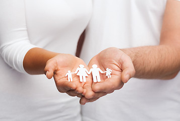 Image showing couple hands with paper man family