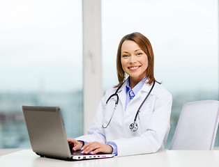 Image showing busy doctor with laptop computer