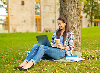 Image showing teenager in eyeglasses with laptop and coffee