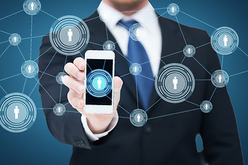 Image showing businessman showing smartphone with network