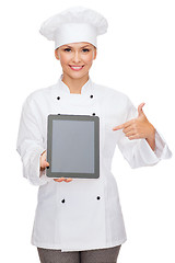 Image showing smiling female chef with tablet pc blank screen