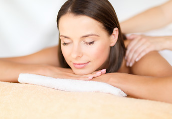 Image showing beautiful woman in spa salon getting massage