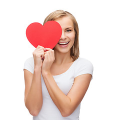 Image showing smiling woman in white t-shirt with heart