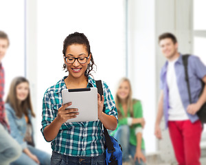 Image showing student in eyeglasses with tablet pc and bag