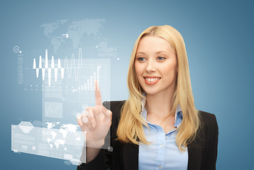 Image showing businesswoman working with visrtual screen