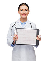 Image showing female doctor with sclipboard and cardiogram