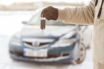 Image showing closeup of man hand with car key outdoors