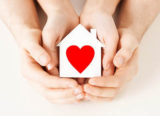 Image showing couple hands holding white paper house