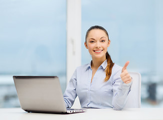 Image showing businesswoman with laptop in office