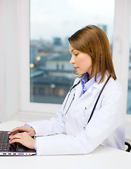 Image showing busy doctor with laptop computer