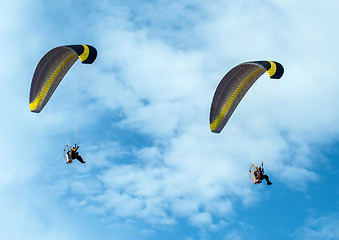 Image showing Paragliding fly on blue sky