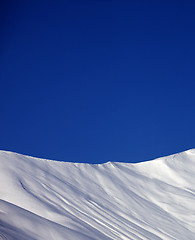 Image showing Off-piste slope and blue clear sky in nice winter day