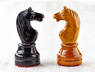 Image showing Two old wooden chess pieces