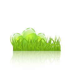 Image showing Easter set eggs in green grass isolated on white background