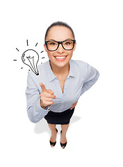 Image showing smiling businesswoman with finger up